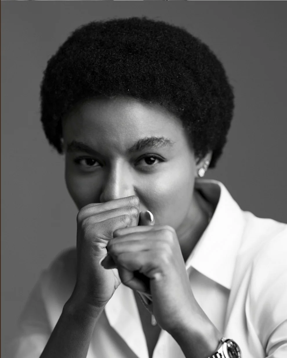 Nancy Isime pinching her nose